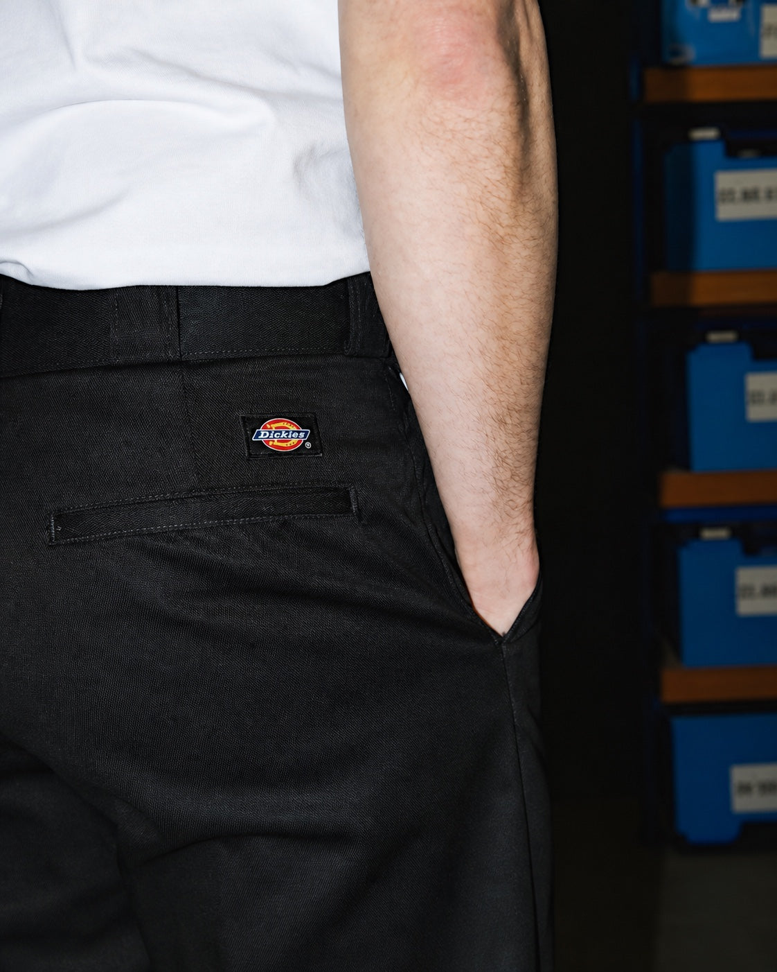 Close detail of black work pants