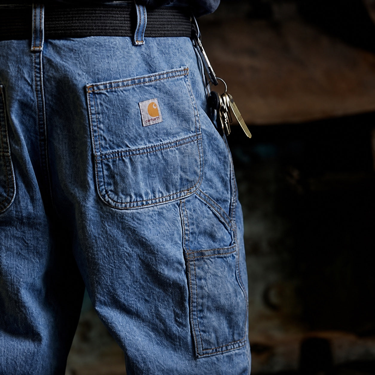 Close detail of denim utility pants